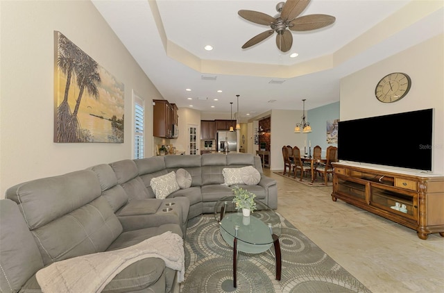 241 Marcheno Way, Nokomis, FL 34275 - living room featuring ceiling fan, recessed lighting, and a tray ceiling