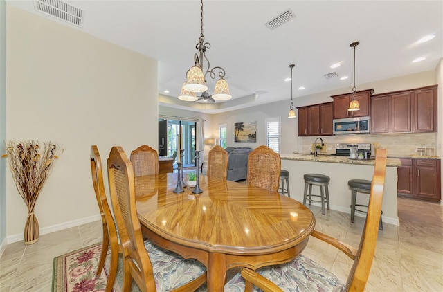 241 Marcheno Way, Nokomis, FL 34275 - dining room with recessed lighting, plenty of natural light, a chandelier, and baseboards