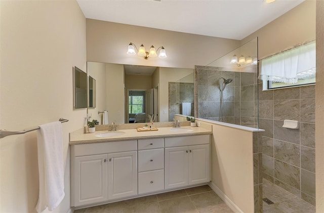 241 Marcheno Way, Nokomis, FL 34275 - bathroom featuring a walk in shower, double vanity, and tile patterned flooring