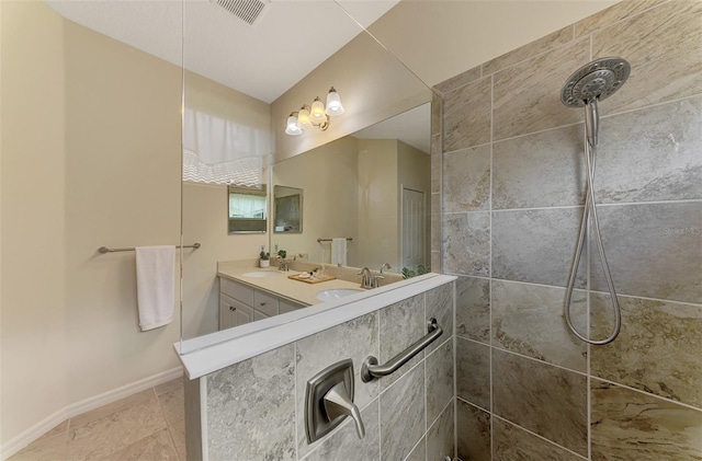 241 Marcheno Way, Nokomis, FL 34275 - full bath with double vanity, a tile shower, and baseboards