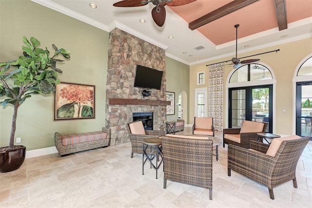 241 Marcheno Way, Nokomis, FL 34275 - living room featuring ceiling fan, a fireplace, crown molding, baseboards, and beam ceiling