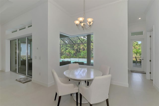 9048 Luna Ln, Sarasota, FL 34241 - dining room with ornamental molding, a chandelier, baseboards, and a high ceiling