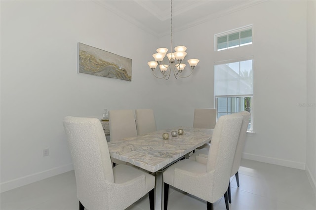 9048 Luna Ln, Sarasota, FL 34241 - dining area with crown molding, a chandelier, healthy amount of natural light, baseboards, and a towering ceiling