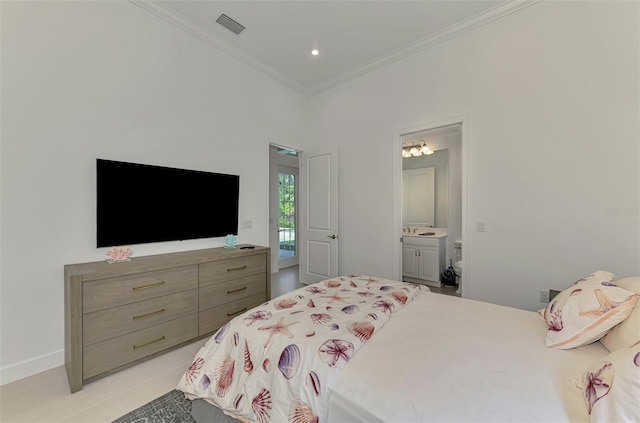 9048 Luna Ln, Sarasota, FL 34241 - bedroom with crown molding, light tile patterned floors, ensuite bathroom, and baseboards