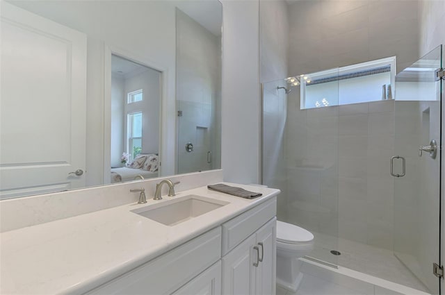 9048 Luna Ln, Sarasota, FL 34241 - ensuite bathroom with plenty of natural light, a shower stall, and toilet