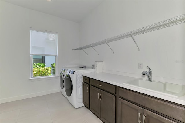 9048 Luna Ln, Sarasota, FL 34241 - laundry area with independent washer and dryer, cabinet space, and baseboards