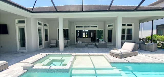 9048 Luna Ln, Sarasota, FL 34241 - view of swimming pool with outdoor lounge area, a patio area, glass enclosure, and a pool with connected hot tub