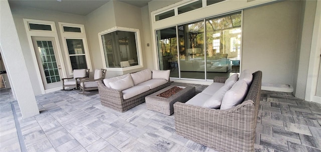9048 Luna Ln, Sarasota, FL 34241 - view of patio / terrace featuring an outdoor living space with a fire pit