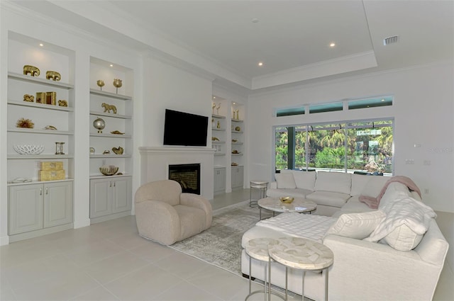 9048 Luna Ln, Sarasota, FL 34241 - living area featuring built in features, a fireplace, ornamental molding, light tile patterned floors, and recessed lighting