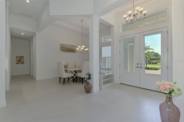 9048 Luna Ln, Sarasota, FL 34241 - entryway with a chandelier, healthy amount of natural light, ornamental molding, recessed lighting, and coffered ceiling