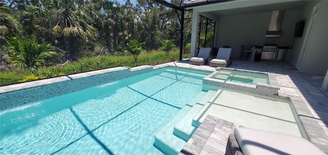 9048 Luna Ln, Sarasota, FL 34241 - view of pool featuring area for grilling, a pool with connected hot tub, and a patio area