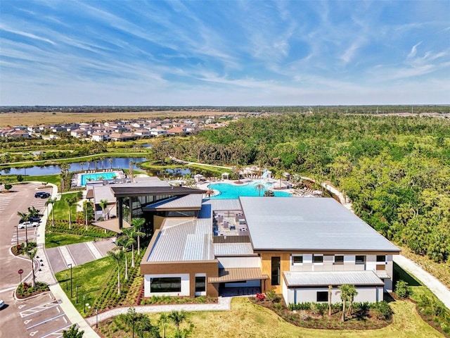 9048 Luna Ln, Sarasota, FL 34241 - drone / aerial view of a pool, a forest, and a nearby body of water