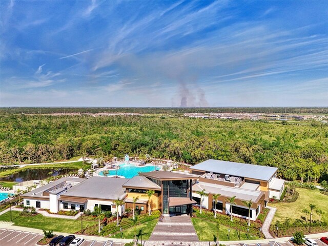 9048 Luna Ln, Sarasota, FL 34241 - drone / aerial view of a forest, a pool, and a large body of water