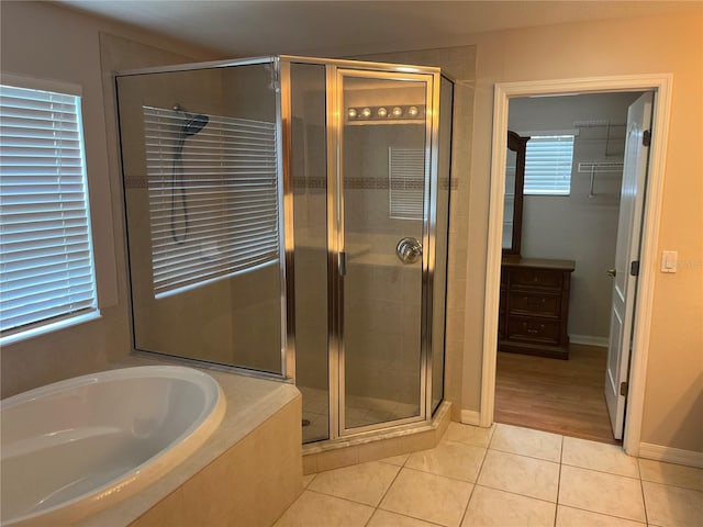 5966 Willows Bridge Loop, Ellenton, FL 34222 - bathroom with tile patterned floors, a stall shower, and a bath