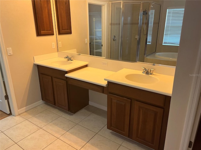 5966 Willows Bridge Loop, Ellenton, FL 34222 - bathroom featuring a shower stall, double vanity, a garden tub, and tile patterned flooring