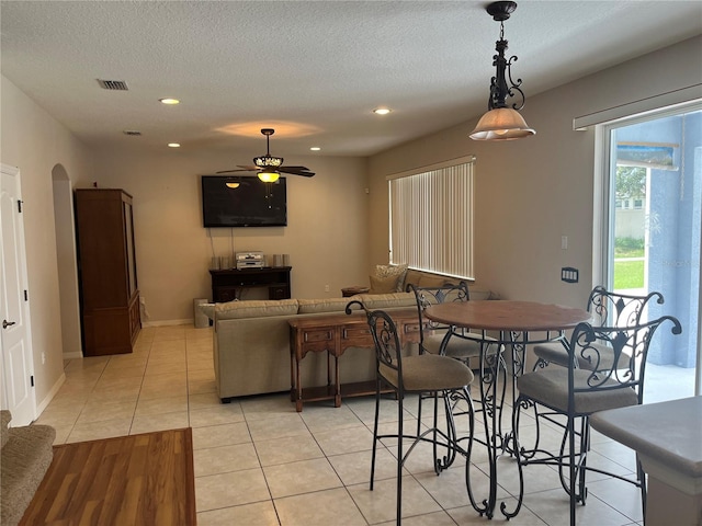 5966 Willows Bridge Loop, Ellenton, FL 34222 - dining space featuring arched walkways, a textured ceiling, ceiling fan, recessed lighting, and light tile patterned floors
