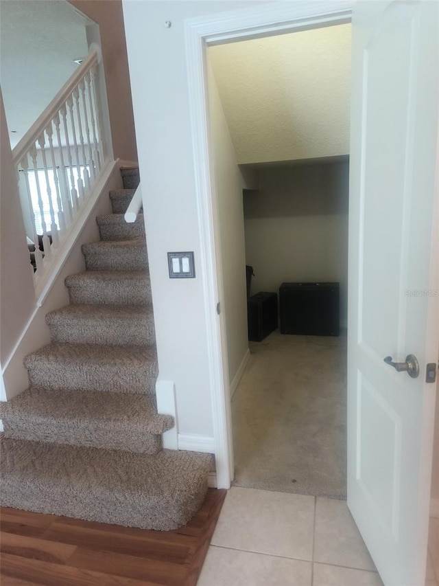 5966 Willows Bridge Loop, Ellenton, FL 34222 - staircase with carpet and tile patterned floors