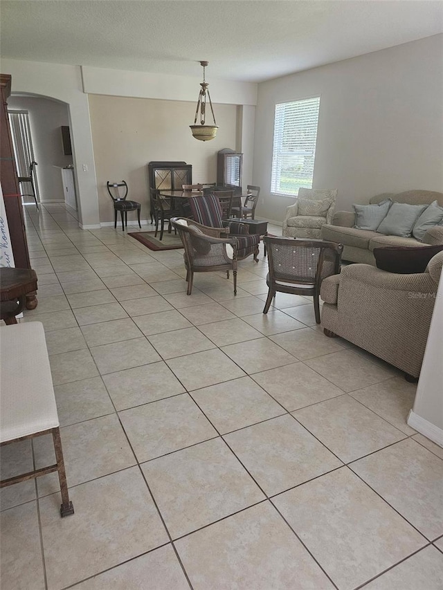 5966 Willows Bridge Loop, Ellenton, FL 34222 - living area with arched walkways and light tile patterned floors