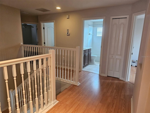 5966 Willows Bridge Loop, Ellenton, FL 34222 - hall with an upstairs landing, wood finished floors, and recessed lighting