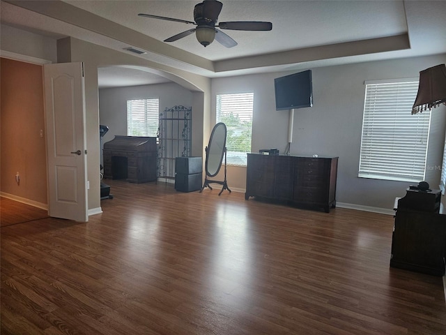 5966 Willows Bridge Loop, Ellenton, FL 34222 - home office featuring a raised ceiling, wood finished floors, arched walkways, and ceiling fan