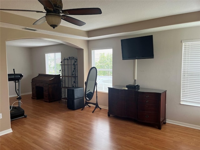 5966 Willows Bridge Loop, Ellenton, FL 34222 - office space featuring arched walkways, light wood-style flooring, ceiling fan, and plenty of natural light
