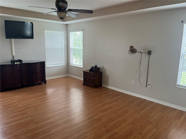 5966 Willows Bridge Loop, Ellenton, FL 34222 - unfurnished living room featuring light wood-style floors, a ceiling fan, and plenty of natural light