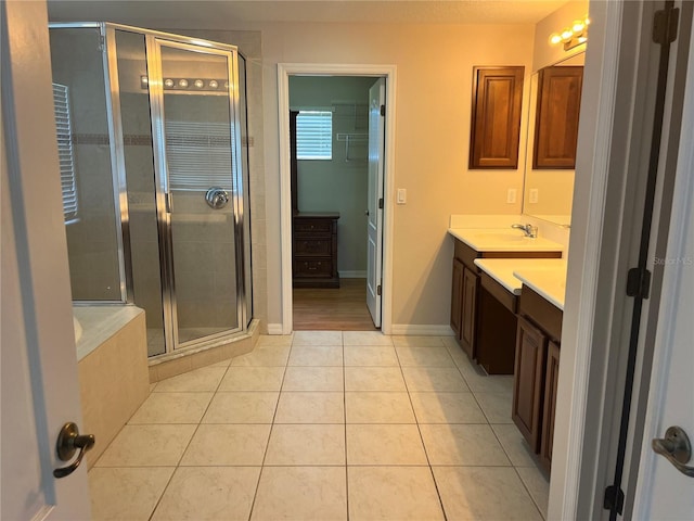 5966 Willows Bridge Loop, Ellenton, FL 34222 - full bathroom with vanity, a stall shower, tile patterned floors, and a garden tub