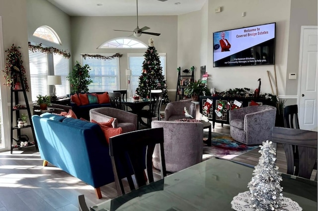 5966 Willows Bridge Loop, Ellenton, FL 34222 - living room featuring a ceiling fan, wood finished floors, and a towering ceiling