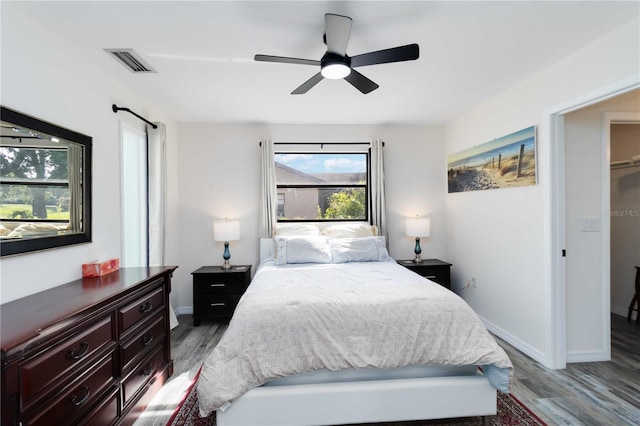 1439 Strada D Argento, Venice, FL 34292 - bedroom with wood finished floors, a ceiling fan, and baseboards