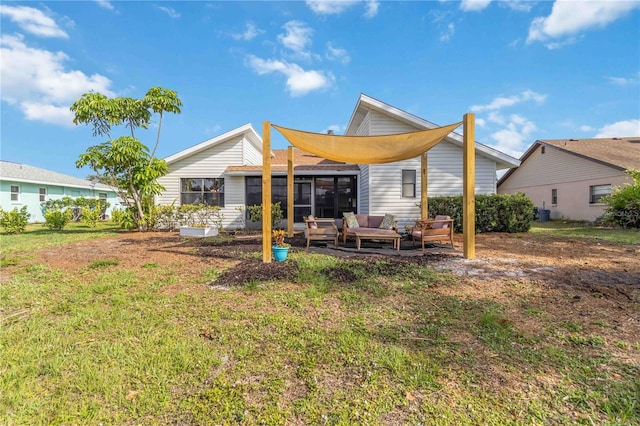 1439 Strada D Argento, Venice, FL 34292 - rear view of property with an outdoor hangout area and a sunroom
