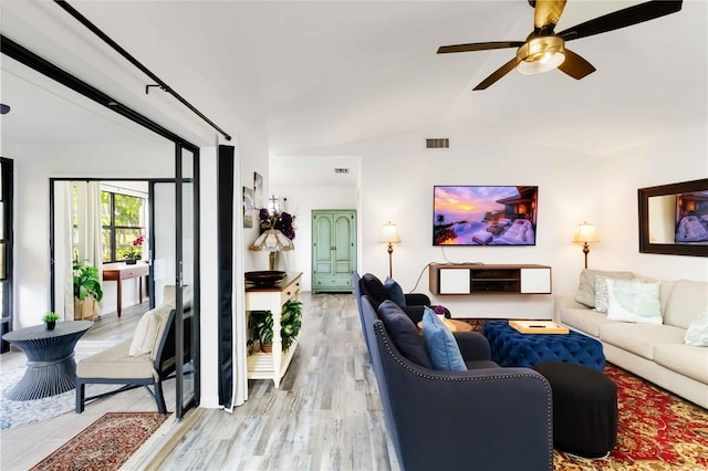 1439 Strada D Argento, Venice, FL 34292 - living area with light wood-style floors, a ceiling fan, and vaulted ceiling