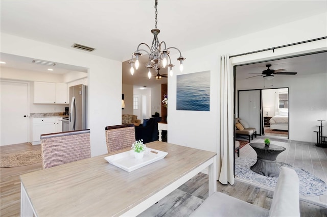 1439 Strada D Argento, Venice, FL 34292 - dining space with light wood finished floors, a chandelier, ceiling fan, and recessed lighting