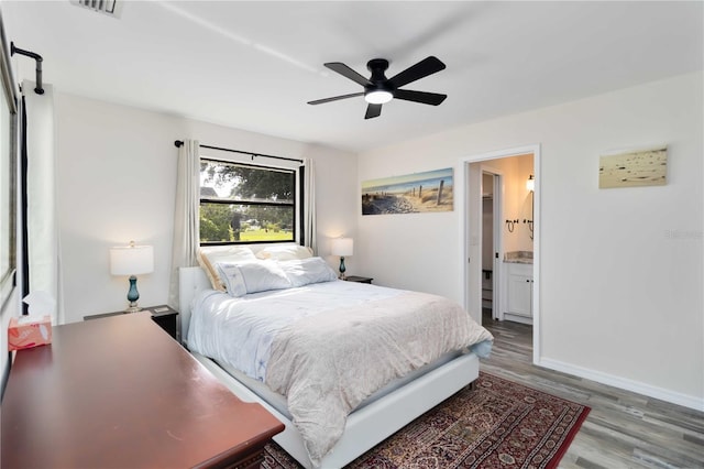 1439 Strada D Argento, Venice, FL 34292 - bedroom with wood finished floors, ceiling fan, and ensuite bath