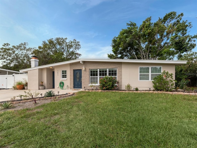 161 Suntan Ave, Sarasota, FL 34237 - view of front of home featuring a chimney and concrete driveway
