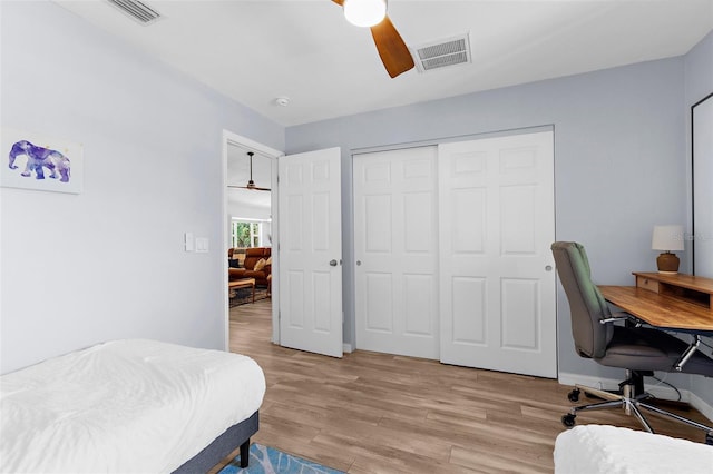 2424 Affinity Ln, North Port, FL 34286 - bedroom featuring light wood-type flooring, a closet, an office area, ceiling fan, and baseboards