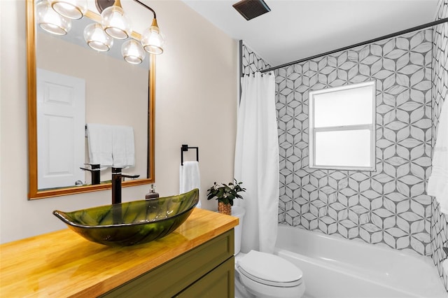 2424 Affinity Ln, North Port, FL 34286 - full bathroom with a chandelier, toilet, vanity, and shower / bath combo with shower curtain
