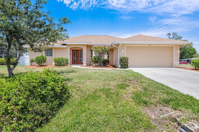 3851 Sterling Rd, Venice, FL 34293 - ranch-style house with french doors, stucco siding, and an attached garage