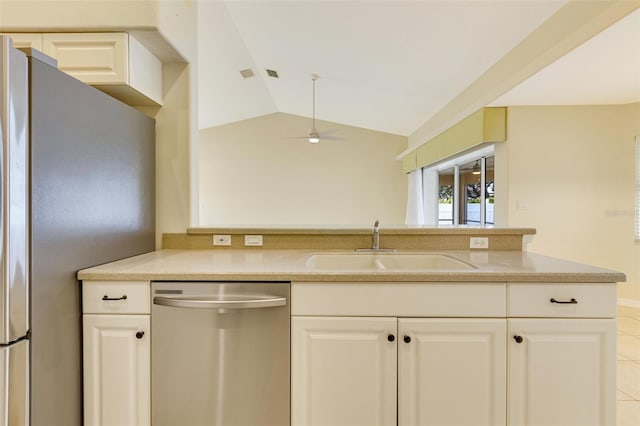 3851 Sterling Rd, Venice, FL 34293 - kitchen with appliances with stainless steel finishes, a sink, vaulted ceiling, a ceiling fan, and light countertops