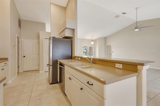 3851 Sterling Rd, Venice, FL 34293 - kitchen with a sink, stainless steel appliances, light tile patterned flooring, a ceiling fan, and high vaulted ceiling