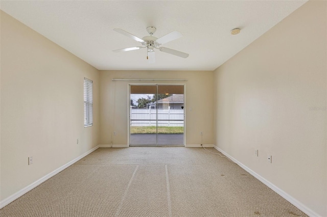 3851 Sterling Rd, Venice, FL 34293 - empty room with a smoke detector, a ceiling fan, light colored carpet, and baseboards