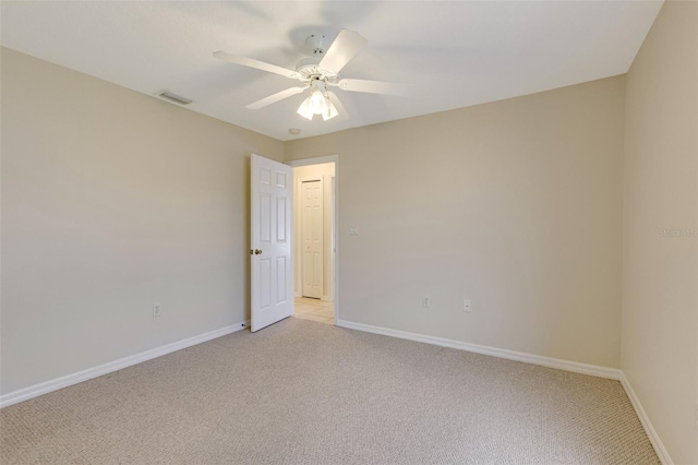 3851 Sterling Rd, Venice, FL 34293 - empty room featuring light carpet, ceiling fan, and baseboards
