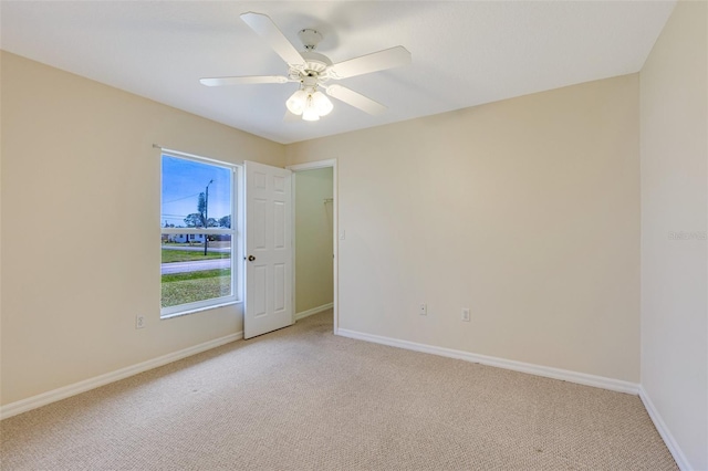 3851 Sterling Rd, Venice, FL 34293 - empty room featuring light colored carpet, baseboards, and a ceiling fan