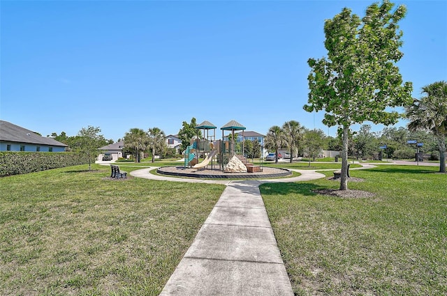 community jungle gym featuring a lawn