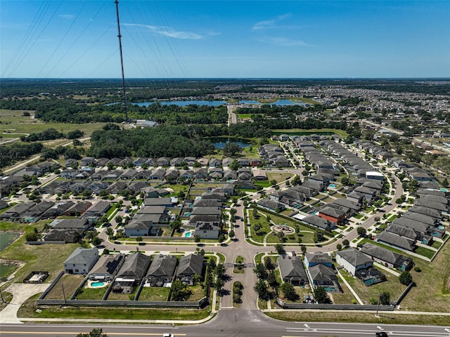 aerial perspective of suburban area with a large body of water