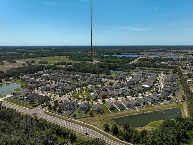 aerial overview of property's location with nearby suburban area and a nearby body of water