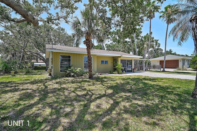 417 Shore Rd Unit A & B, Nokomis, FL 34275 - ranch-style house with a front lawn and a garage