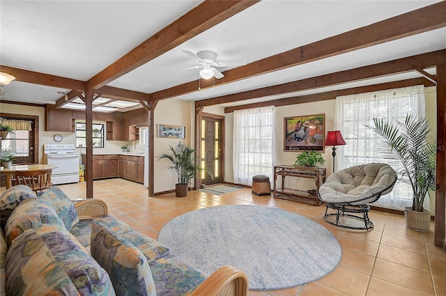 417 Shore Rd Unit A & B, Nokomis, FL 34275 - living room featuring light tile patterned flooring, beam ceiling, a ceiling fan, and baseboards
