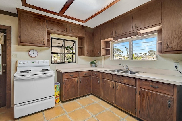 417 Shore Rd Unit A & B, Nokomis, FL 34275 - kitchen featuring white range with electric stovetop, open shelves, a sink, light countertops, and plenty of natural light