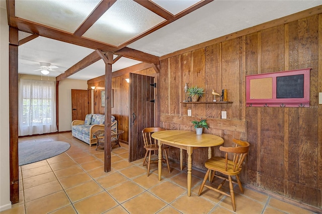 417 Shore Rd Unit A & B, Nokomis, FL 34275 - dining room featuring wood walls, ceiling fan, and light tile patterned floors
