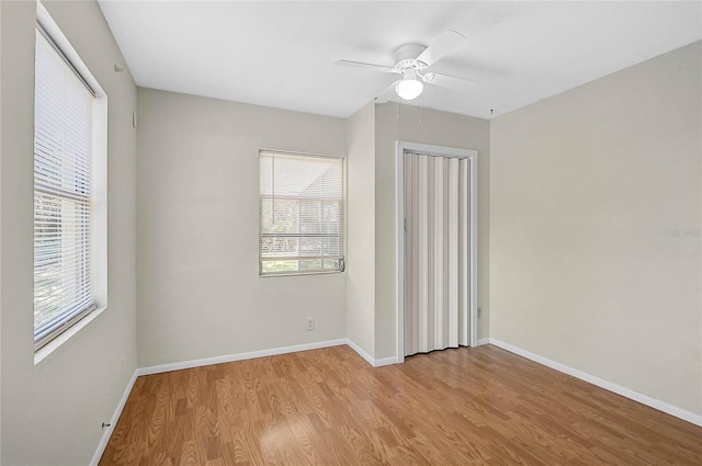 417 Shore Rd Unit A & B, Nokomis, FL 34275 - empty room with wood finished floors, healthy amount of natural light, baseboards, and ceiling fan